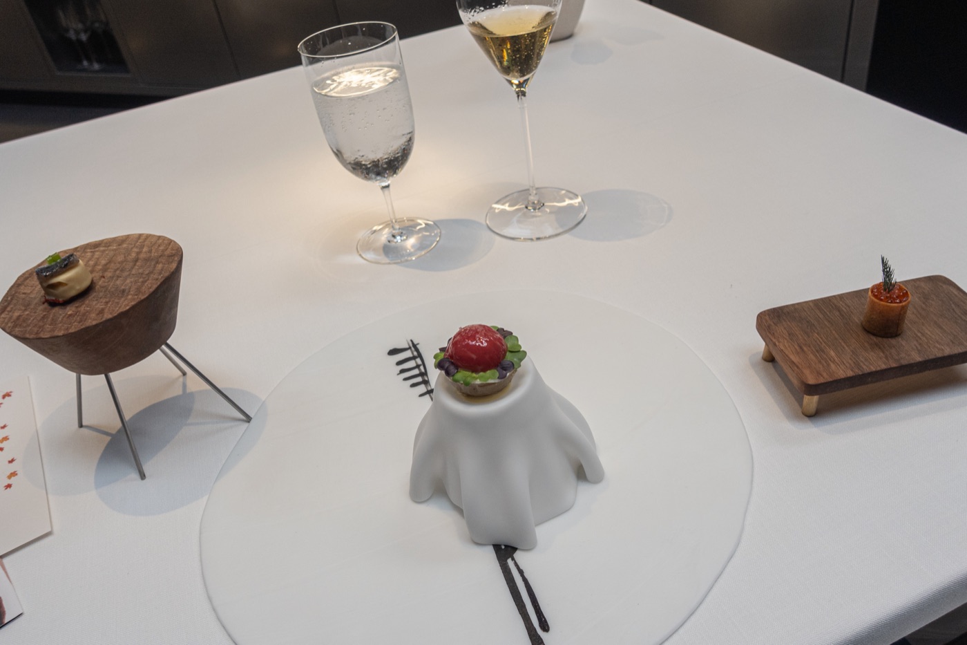 The appetizers arrive together: ‘Piparras’ and Smoked Anchovy bonbon, Crispy Panot with pickles, and Marinated tuna, roe and ‘Mojo Picón’.