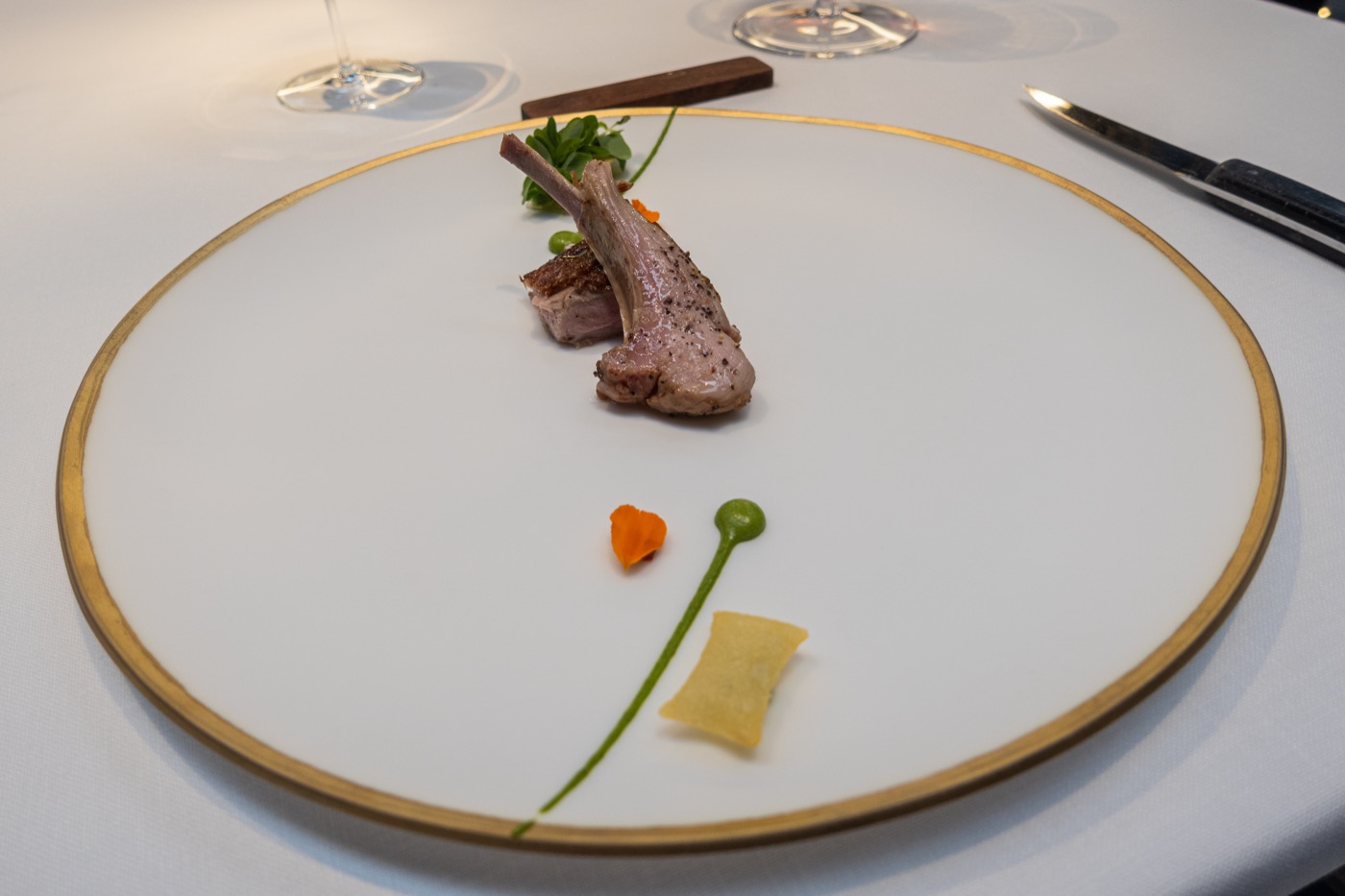 Aged suckling lamb with herbs, Padrón peppers, soufflé potatoes and ají. Spring.