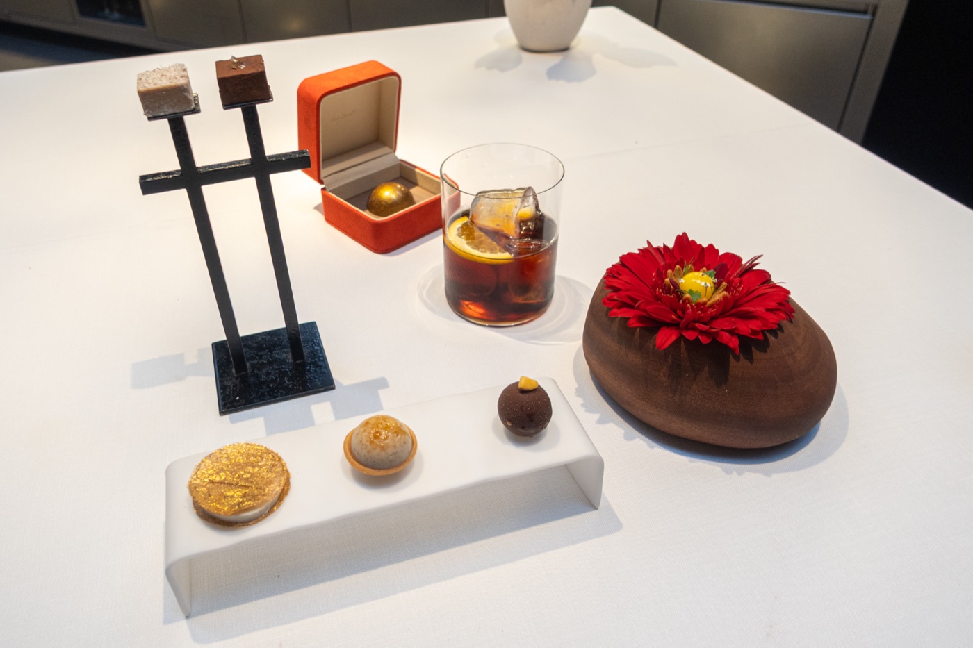 Orange Flower, The Jewel and the sweets together on the table.