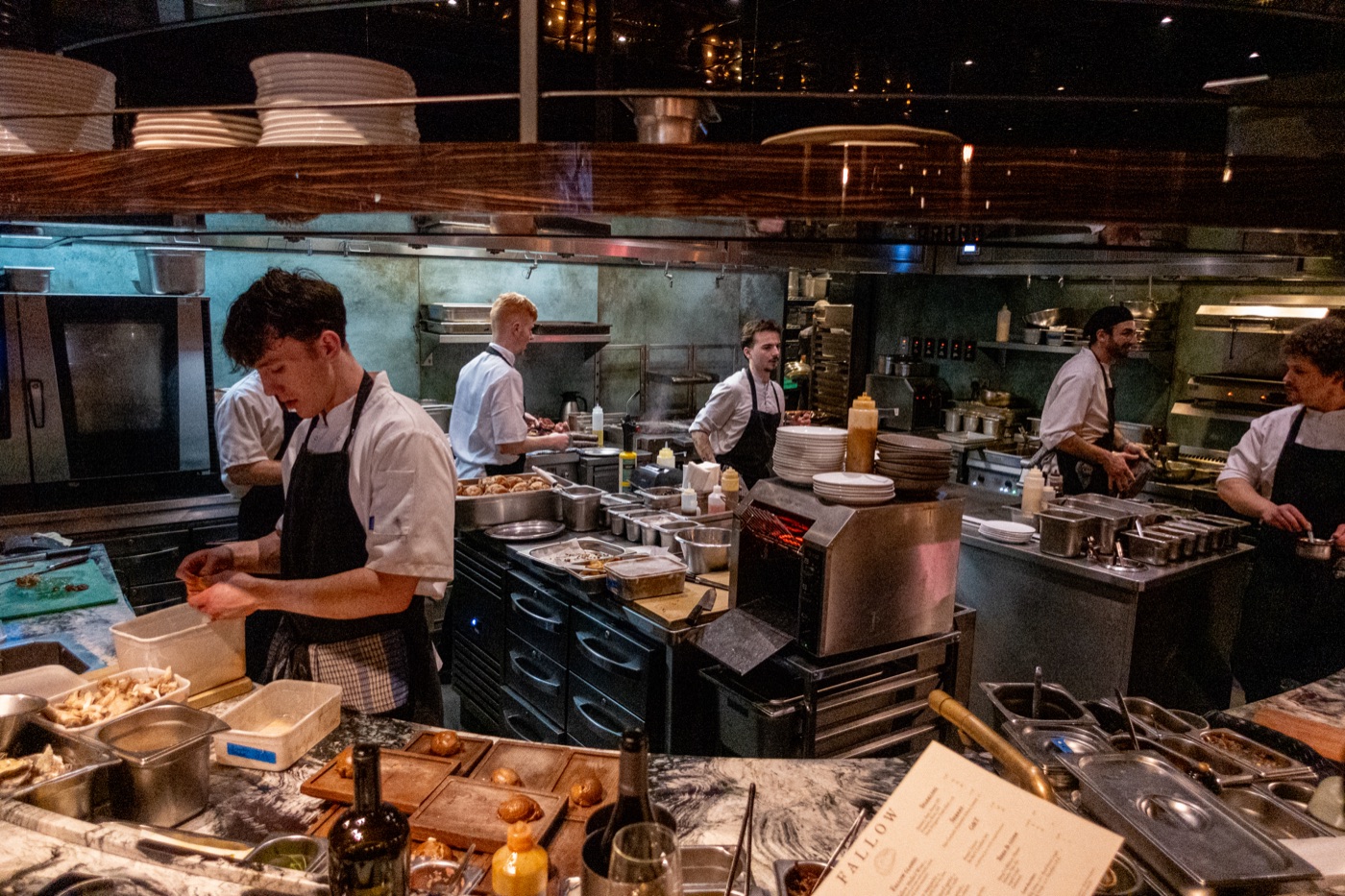 Cooks at work in the open kitchen.